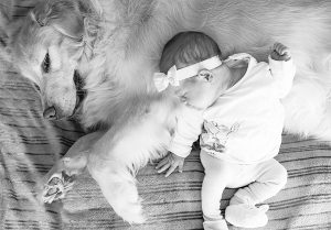 Baby girl and dog
